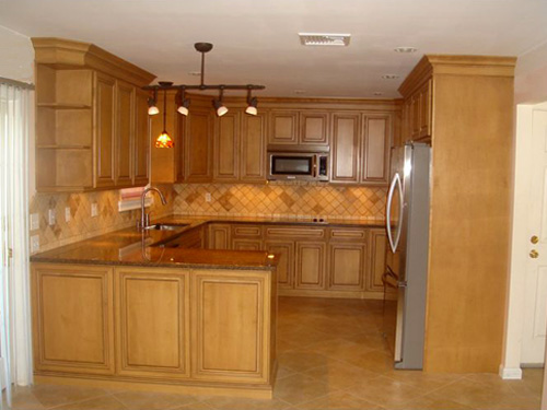 Plenty of kitchen storage and work areas plus tile